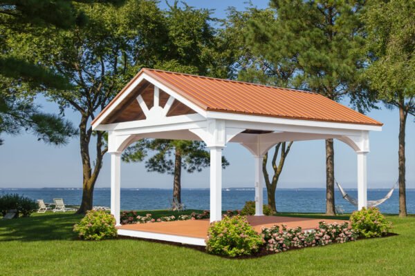 white vinyl pavilion with metal roofing by the beach