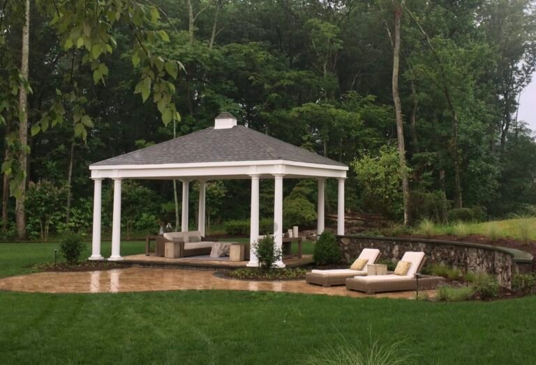 Large white vinyl pavilion with double posts and a small cupola